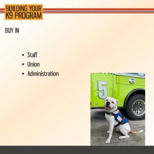 A white dog wearing a service vest sits in front of a green emergency vehicle next to a presentation slide titled "Building Your K9 Program" with bullet points for staff, union, and administration.